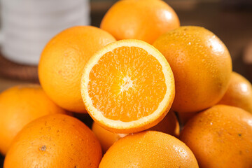 Fresh Sweet Navel Oranges with Cut Half Showing Juicy Interior - Citrus Fruit Collection
