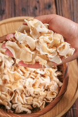 Premium Dried White Jade Mushrooms from Changbaishan - Traditional Harvest in Wooden Bowl