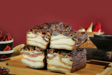 Artisanal Smoked Bacon Slices on Wooden Board - Traditional Woodfired Cured Meat