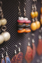 Colorful handmade earrings displayed at local market