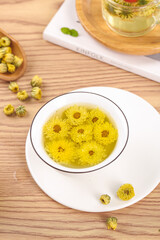 Traditional Chinese Chrysanthemum Flower Tea with Dried Flowers on Wooden Table - Herbal Medicine and Natural Health Concept