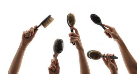 Multiple hands holding hairbrushes isolated on transparent background