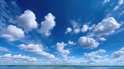 Bright Blue Sky Filled With Fluffy White Clouds Above Calm Water Surface in Daytime Outdoor Scenery Under Sunlight Serene Cloudscape Horizon Panorama
