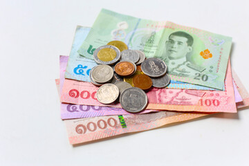 Fototapeta premium Banknotes with coins of the Thai baht money