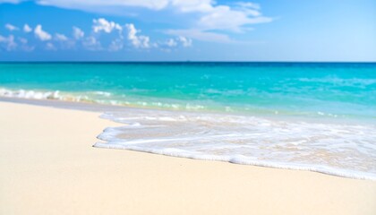 Fototapeta premium A serene background of a soft-focus beach with gentle wave foam.
