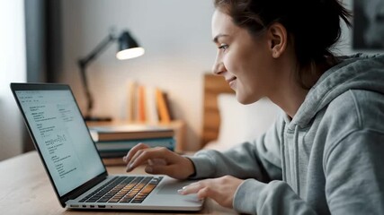 Close up high school student programming laptop cinematic handheld coding education lifestyle stock video. teen coder notebook closeup handheld filmic learning digital skill future - Powered by Adobe