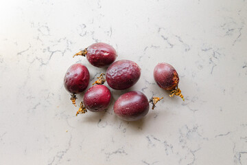 delicious and juicy exotic fruit - passion fruit on a kitchen counter, natural light