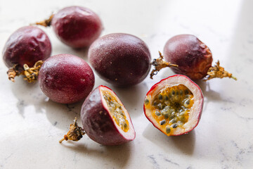 delicious and juicy exotic fruit - passion fruit on a kitchen counter, natural light