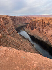 Experience the stunning view of Horseshoe Bend dramatically transformed at sunrises embrace