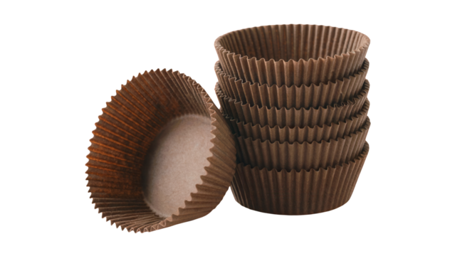 A stack of brown paper cupcake liners and one individual liner next to it isolated on transparent background