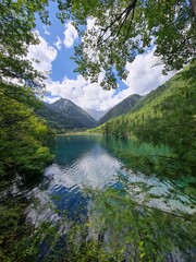 Reflection on the surface of a lake in summer in Jiuzhaigou National Park, China.
