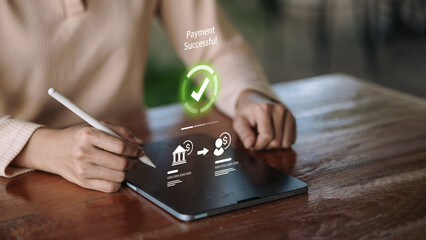 Mobile banking payment successful on tablet with stylus and secure money transfer
