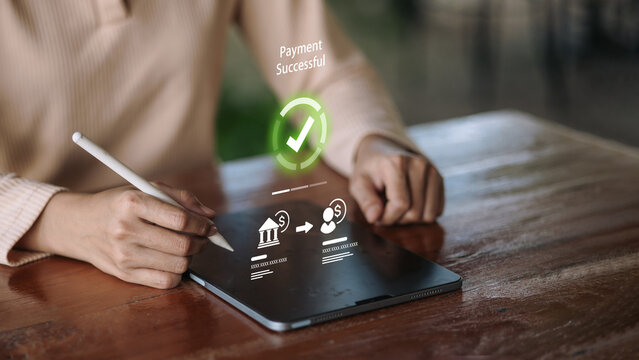 Mobile banking payment successful on tablet with stylus and secure money transfer