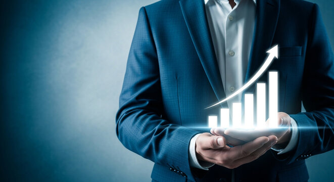 Businessman holding smartphone with growing graph on screen showing business success and financial growth