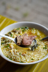 Soto Pikoel, captured on September 19, 2025. Traditional Indonesian soup with rich spiced broth, tender beef cuts, bean sprouts, vermicelli, and fresh herbs, served with rice and condiments