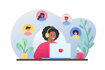 Woman wearing headphones on a video call with diverse colleagues connected remotely on a laptop