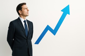 Professional Man in Suit Observing Graph with Arrow Indicating Growth and Success in Financial or Business Context