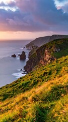 Scenic Coastal View at Sunset with Cliffs and Ocean Horizon