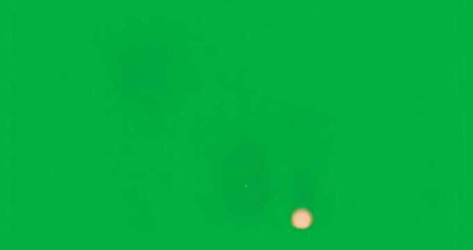 Glowing discs appearing on deep blue backdrop then shifting to create rhythmic light pulses