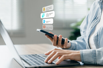 Young woman using phone with social media notifications on screen