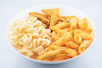Assorted Crispy Snacks Mix in White Bowl on White Background