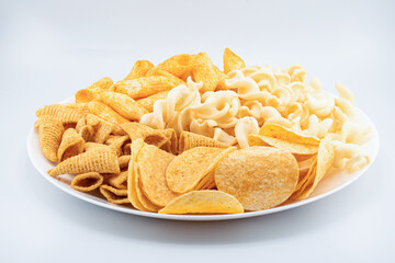 Assorted Crispy Snacks Mix in White Bowl on White Background