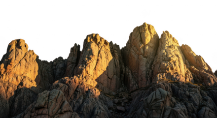 Jagged mountain peaks illuminated by golden hour light isolated on transparent background