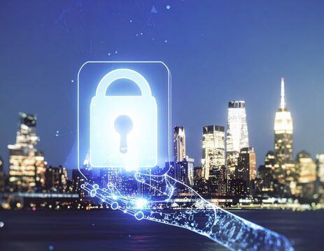 Digital hand holding a glowing padlock above a blurred cityscape at night, representing cybersecurity and data protection.