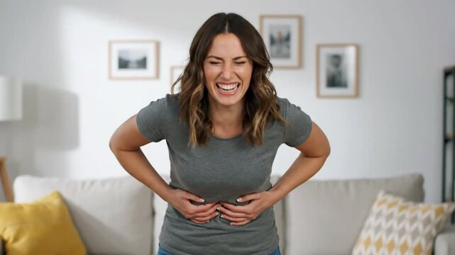 Funny awkward woman holding belly with strained face like resisting poop
