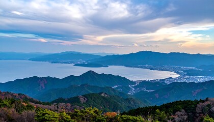 Obraz premium Panoramic mountain vista over lake and city