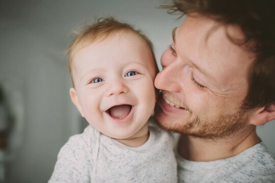 Happy father and baby sharing joyful moment of love and laughter