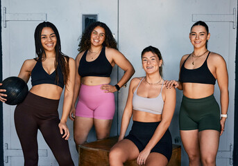 Group of Confident diverse Women in Athletic Wear Relaxing Together After a Workout Session
