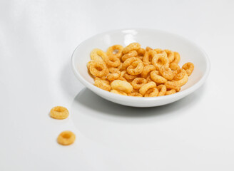 Potato ring biscuit snack close-up, white background