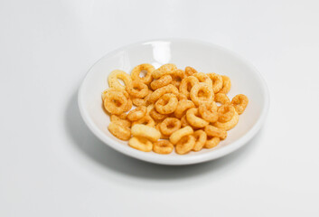Potato ring biscuit snack close-up, white background
