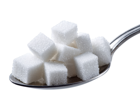 Sugar cubes in a metal spoon isolated on a white background