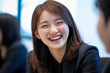 Young Businesswoman Smiling Joyfully in a Professional Setting