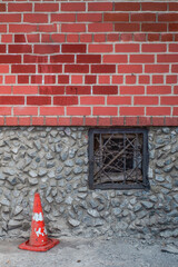 Fragment of the facade of a brick building on an autumn day
