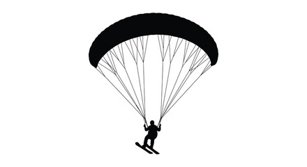 Silhouette of a paraglider soaring through the sky with a skier