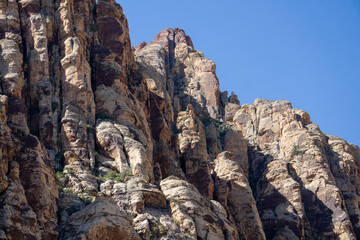 mountain face with blue sky