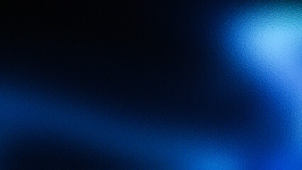 Abstract dark blue background with bright blue light and textured surface