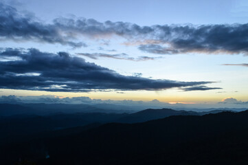 Obraz premium Landscape Sunset in Twilight time Over the Mountains in the Evening at Doi Suthep-Pui National Park,Chiang mai, Northern Thailand.