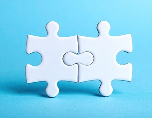 Obraz premium Two white puzzle pieces joined