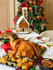 Xmas, Christmas festive concept, roast turkey and trimmings on dining table with decoration