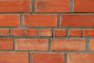 brick wall of a house with sunlight, close view