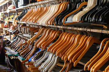 A collection of coat hangers in storage in a clothing store.