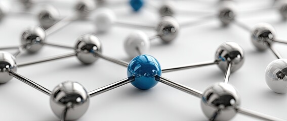 Abstract network of metallic spheres, primarily silver, with a single blue sphere at the center, interconnected by thin rods