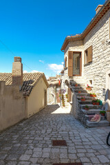 A street among the old houses of Pescopagano, a small medieval town in the province of Potenza, Italy.