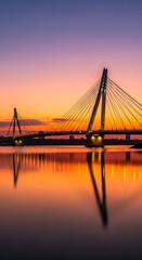 Obraz premium Modern Cable-stayed Bridge at Sunset with Calm Water Reflection