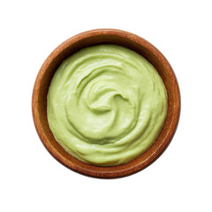Fototapeta premium Creamy green avocado sauce in wooden bowl on transparent background