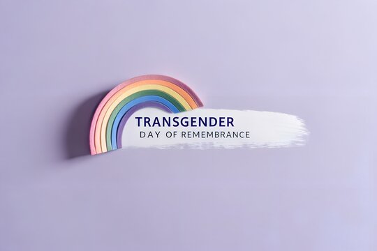 Transgender day of remembrance with rainbow on purple background, top view